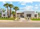Beautiful modern home with white brick, manicured lawn, and desert landscaping at 7001 E Joan De Arc Ave, Scottsdale, AZ 85254