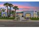 Stunning modern home with palm trees and a walkway leading to the front door at 7001 E Joan De Arc Ave, Scottsdale, AZ 85254