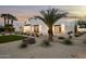 Stunning modern home with a desert landscape, palm trees, and white brick accents create a stylish curb appeal at 7001 E Joan De Arc Ave, Scottsdale, AZ 85254