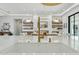 Modern, open concept kitchen featuring a large island, gold fixtures, and seamless transition to the living area at 7001 E Joan De Arc Ave, Scottsdale, AZ 85254
