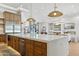 Well-lit kitchen boasting a large island with cabinetry, stainless steel appliances, and modern finishes at 7001 E Joan De Arc Ave, Scottsdale, AZ 85254
