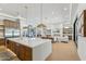Expansive open-concept living area with a modern kitchen, fireplace, and seamless flow for entertaining at 7001 E Joan De Arc Ave, Scottsdale, AZ 85254
