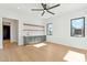 Bright living room featuring a modern wet bar with marble backsplash, hardwood floors, and lots of natural light at 7001 E Joan De Arc Ave, Scottsdale, AZ 85254