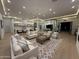 Spacious living area with hardwood floors, neutral decor, modern lighting, and easy kitchen access at 7001 E Joan De Arc Ave, Scottsdale, AZ 85254