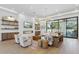 Spacious living area with a fireplace, built-ins, and large windows offering great backyard views at 7001 E Joan De Arc Ave, Scottsdale, AZ 85254