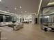 Open-concept living room and kitchen featuring hardwood floors, modern lighting, and stylish furnishings at 7001 E Joan De Arc Ave, Scottsdale, AZ 85254