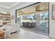 Seamless indoor-outdoor living with a covered patio, dining area, and refreshing pool view at 7001 E Joan De Arc Ave, Scottsdale, AZ 85254
