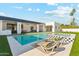 Stunning backyard pool with modern lounge chairs and a spa, perfect for relaxation and entertaining at 7001 E Joan De Arc Ave, Scottsdale, AZ 85254