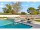 Lovely pool and spa with black and white tile, complemented by comfortable lounge seating at 7001 E Joan De Arc Ave, Scottsdale, AZ 85254