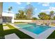 Expansive backyard pool and spa with stylish lounge seating and beautiful landscaping at 7001 E Joan De Arc Ave, Scottsdale, AZ 85254