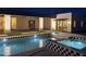 Modern pool and spa with black and white tile accent, surrounded by an outdoor living space at 7001 E Joan De Arc Ave, Scottsdale, AZ 85254