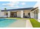 Inviting backyard pool with a spa, alongside covered outdoor dining and lounge spaces at 7001 E Joan De Arc Ave, Scottsdale, AZ 85254