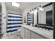 Bathroom featuring double vanity with modern fixtures, ample lighting, and a separate shower at 7020 E Friess Dr, Scottsdale, AZ 85254