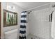 Bathroom featuring an updated subway tile walk-in shower with unique art and decorative lighting at 7020 E Friess Dr, Scottsdale, AZ 85254