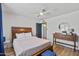 Bright bedroom featuring a ceiling fan, wood floors and a vanity table at 7020 E Friess Dr, Scottsdale, AZ 85254