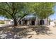 Charming single-story home featuring desert landscaping and unique architectural details at 7020 E Friess Dr, Scottsdale, AZ 85254