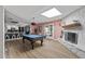 Large game room with a pool table, fireplace, and stylish decor for entertainment at 7020 E Friess Dr, Scottsdale, AZ 85254