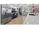 Bright kitchen featuring stainless steel refrigerator, ample counter space, and a breakfast bar at 7020 E Friess Dr, Scottsdale, AZ 85254