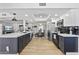 Open-concept kitchen with stainless steel appliances, a large island, and seamless flow to the dining area at 7020 E Friess Dr, Scottsdale, AZ 85254