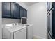 Laundry room featuring washer, dryer and storage space at 7020 E Friess Dr, Scottsdale, AZ 85254
