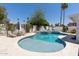 Inviting backyard pool with lounge chairs, lush greenery, and a serene, private setting at 7020 E Friess Dr, Scottsdale, AZ 85254