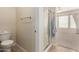Bathroom with a toilet, shower with glass door, and access to the bedroom at 7445 E Eagle Crest Dr # 1111, Mesa, AZ 85207