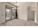 Bright dining room with chandelier lighting and sliding glass doors to balcony at 7445 E Eagle Crest Dr # 1111, Mesa, AZ 85207