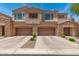Stylish townhome featuring a two-car garage and stone accents in a well-maintained community at 7445 E Eagle Crest Dr # 1111, Mesa, AZ 85207