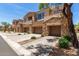 Beautiful exteriors highlight the home's inviting entrance and well-maintained landscaping at 7445 E Eagle Crest Dr # 1111, Mesa, AZ 85207