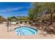 Inviting hot tub area with convenient access, complemented by lush landscaping and community amenities at 7445 E Eagle Crest Dr # 1111, Mesa, AZ 85207