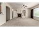 Inviting living area with a fireplace, built-in niches, and neutral decor, ready for personal touches at 7445 E Eagle Crest Dr # 1111, Mesa, AZ 85207