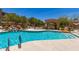 Resort-style pool with waterfall feature and covered seating area, perfect for relaxation and outdoor enjoyment at 7445 E Eagle Crest Dr # 1111, Mesa, AZ 85207