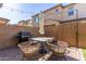 Patio area featuring outdoor seating and barbecue grill with privacy wall at 754 E Harper St # 102, Gilbert, AZ 85297