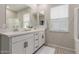 Modern bathroom with dual sinks, stylish cabinets, and a large mirror is bright and airy at 754 E Harper St # 102, Gilbert, AZ 85297