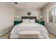Comfortable bedroom features a large bed, modern decor, and plenty of natural light from the window at 754 E Harper St # 102, Gilbert, AZ 85297
