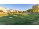 Lush community green space with manicured lawns, mature trees, and charming residential homes at 754 E Harper St # 102, Gilbert, AZ 85297