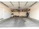Spacious garage featuring ample overhead storage racks and room for multiple bikes and sports equipment at 754 E Harper St # 102, Gilbert, AZ 85297
