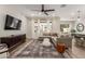 Open-concept living room is bathed in natural light with a sleek entertainment center at 754 E Harper St # 102, Gilbert, AZ 85297