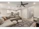 Spacious living room seamlessly connects to the modern kitchen and staircase at 754 E Harper St # 102, Gilbert, AZ 85297