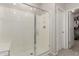 The walk in shower features a large glass enclosure, seat and bright white finishes at 754 E Harper St # 102, Gilbert, AZ 85297