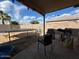The backyard features a covered patio, trampoline, and grilling area, perfect for outdoor entertaining and recreation at 7664 W Vermont Ave, Glendale, AZ 85303