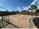 Backyard with a block wall, trampoline and blank slate for landscaping; opportunity for outdoor activities at 7664 W Vermont Ave, Glendale, AZ 85303