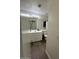 Neutral bathroom featuring a single sink vanity, and wood-look floors at 7664 W Vermont Ave, Glendale, AZ 85303