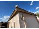 Stucco house with tiled roof, outdoor lantern and garage at 7664 W Vermont Ave, Glendale, AZ 85303