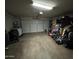 Spacious two-car garage filled with storage and clutter at 7664 W Vermont Ave, Glendale, AZ 85303