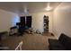 This living room has carpet flooring and a large window at 7664 W Vermont Ave, Glendale, AZ 85303