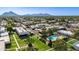 Aerial view of the community with mature landscaping and the pool at 8317 E Orange Blossom Ln, Scottsdale, AZ 85250
