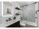Bright bathroom featuring a shower-tub combo and modern vanity at 8317 E Orange Blossom Ln, Scottsdale, AZ 85250
