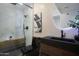 Modern bathroom featuring a walk-in shower and sleek fixtures at 8317 E Orange Blossom Ln, Scottsdale, AZ 85250