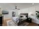 Bedroom featuring an upholstered bed, panel molding, and wood floors at 8317 E Orange Blossom Ln, Scottsdale, AZ 85250